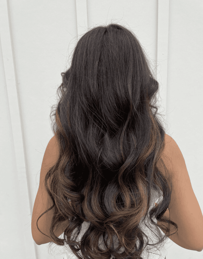 CombLine hair extensions for thinning hair creating fuller, natural-looking dark brunette waves.
